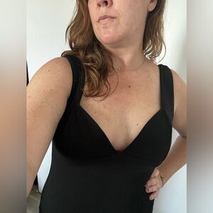 Sexy black dress from Nasty Gal with high slit. Women’s size large.
